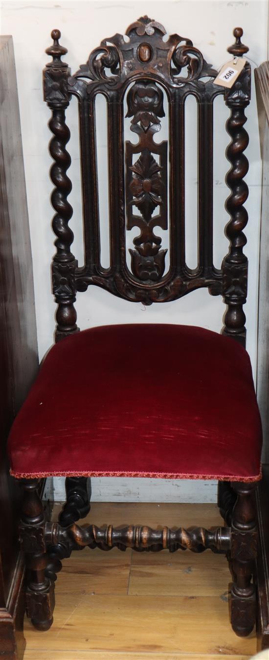 A pair of 19th century Flemish carved oak dining chairs